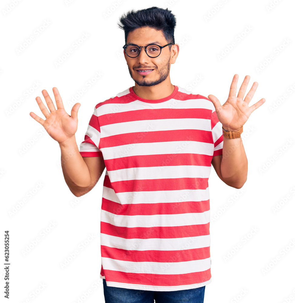 Handsome latin american young man wearing casual clothes and glasses showing and pointing up with fingers number ten while smiling confident and happy. Handsome latin american young man wearing casual clothes and glasses showing and pointing up with fingers number ten while smiling confident and happy.
