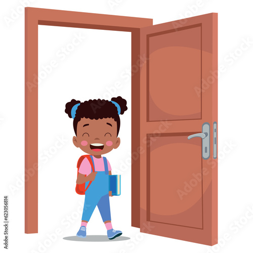 little kid standing and holding door knob