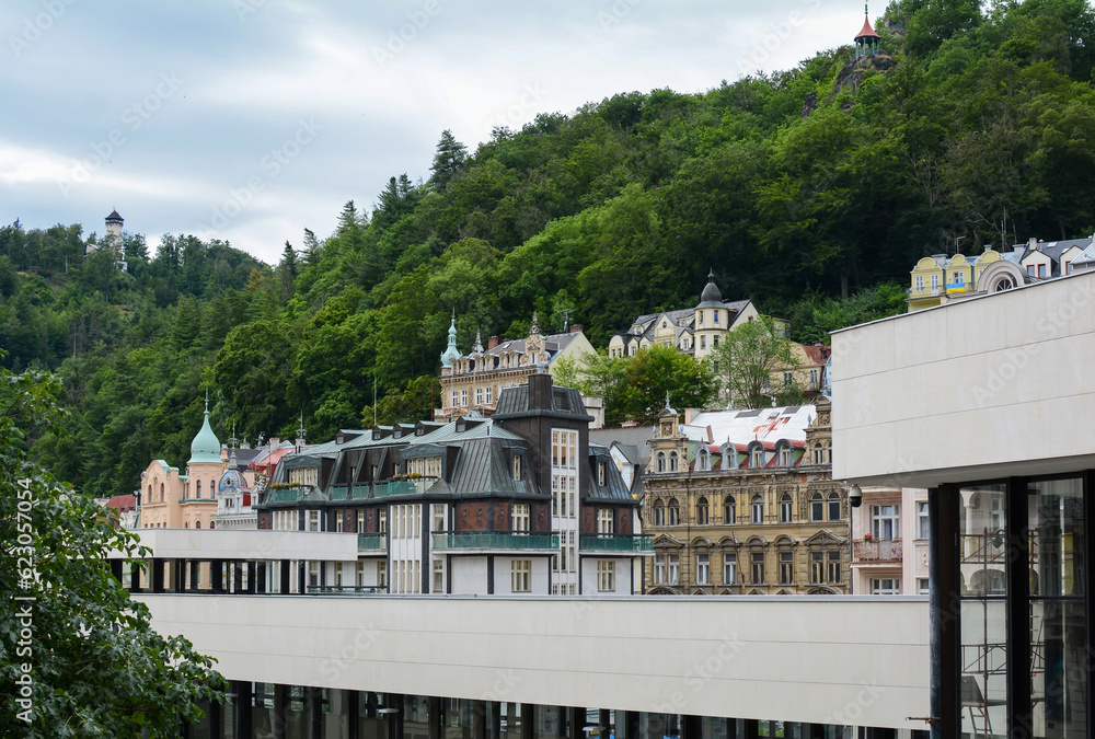 Beautiful buildings in traditional spa town of Karlovy Vary, Czech Republic. Traditional buildings of Karlovy Vary with the hills in the background.