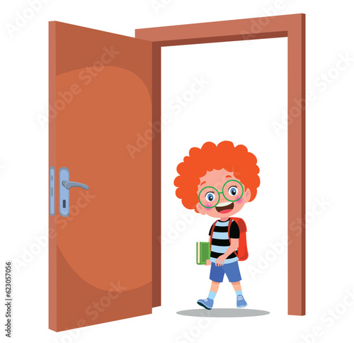 little kid standing and holding door knob
