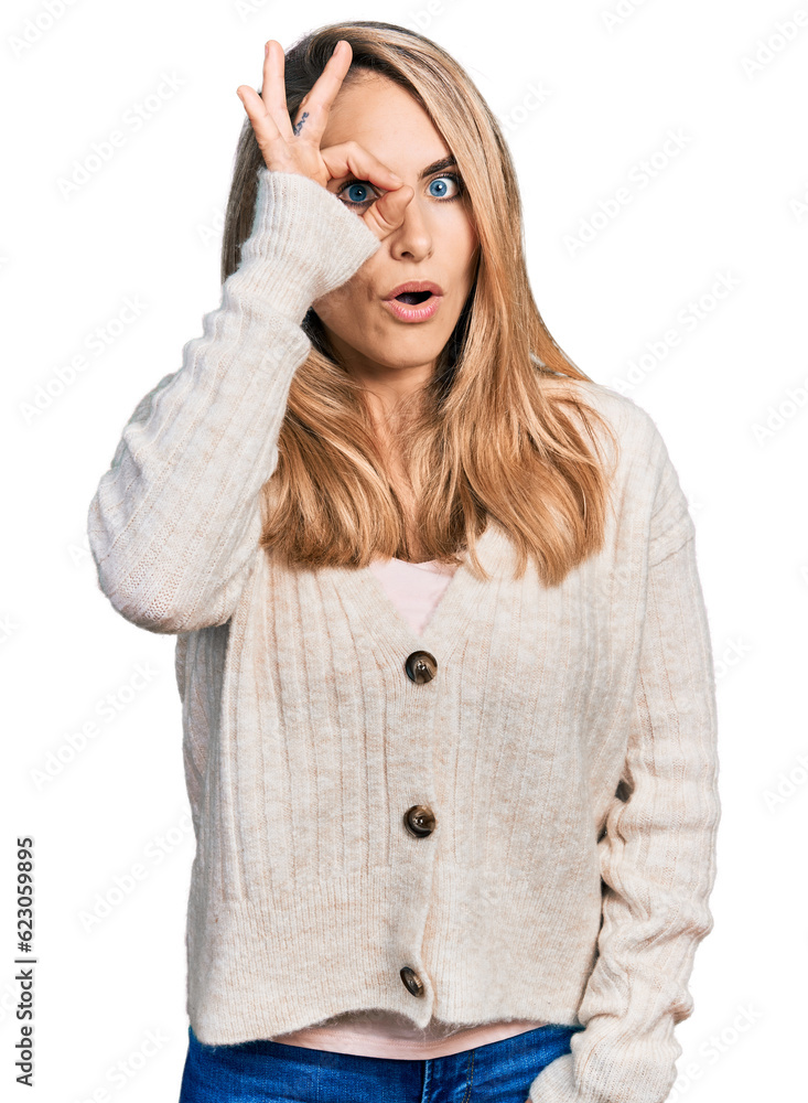 Young blonde woman wearing casual clothes doing ok gesture shocked with surprised face, eye looking through fingers. unbelieving expression. Young blonde woman wearing casual clothes doing ok gesture shocked with surprised face, eye looking through fingers. unbelieving expression.