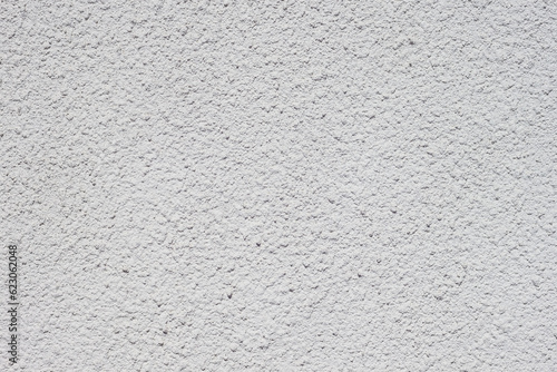 Texture of decorative plaster with a relief. White plaster. Close-up.