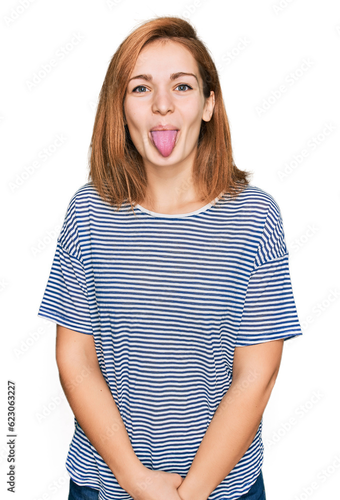 Young caucasian woman wearing casual clothes sticking tongue out happy with funny expression. emotion concept.
