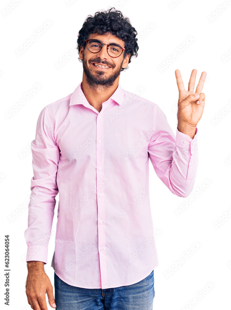 Handsome young man with curly hair and bear wearing business clothes showing and pointing up with fingers number three while smiling confident and happy. Handsome young man with curly hair and bear wearing business clothes showing and pointing up with fingers number three while smiling confident and happy.
