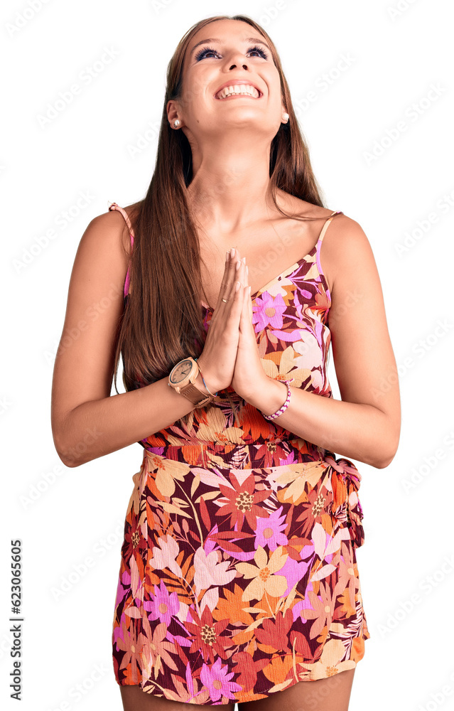 Young beautiful hispanic woman wearing casual clothes begging and praying with hands together with hope expression on face very emotional and worried. begging.