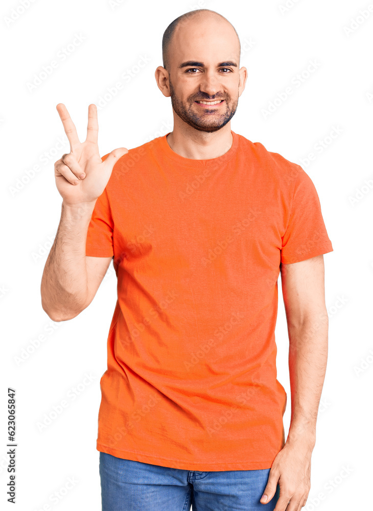 Young handsome man wering casual t shirt showing and pointing up with fingers number three while smiling confident and happy. Young handsome man wering casual t shirt showing and pointing up with fingers number three while smiling confident and happy.