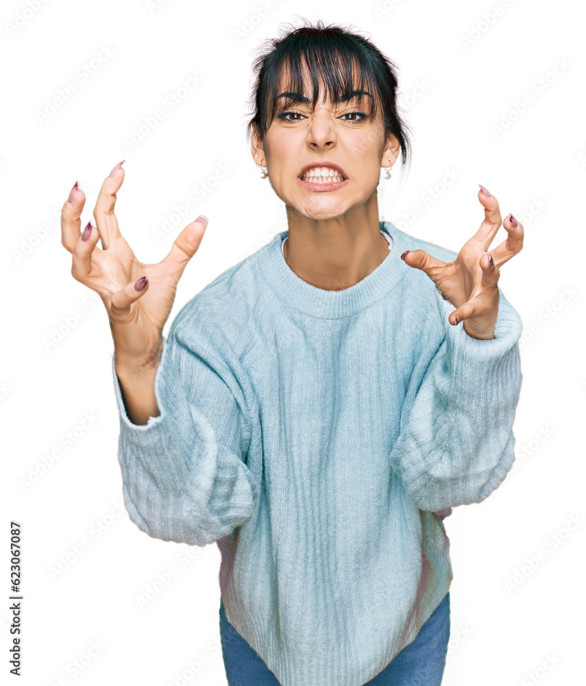Young hispanic woman wearing casual clothes shouting frustrated with rage, hands trying to strangle, yelling mad Young hispanic woman wearing casual clothes shouting frustrated with rage, hands trying to strangle, yelling mad