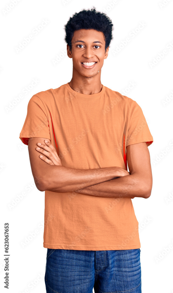 Young african american man wearing casual clothes happy face smiling with crossed arms looking at the camera. positive person. Young african american man wearing casual clothes happy face smiling with crossed arms looking at the camera. positive person.