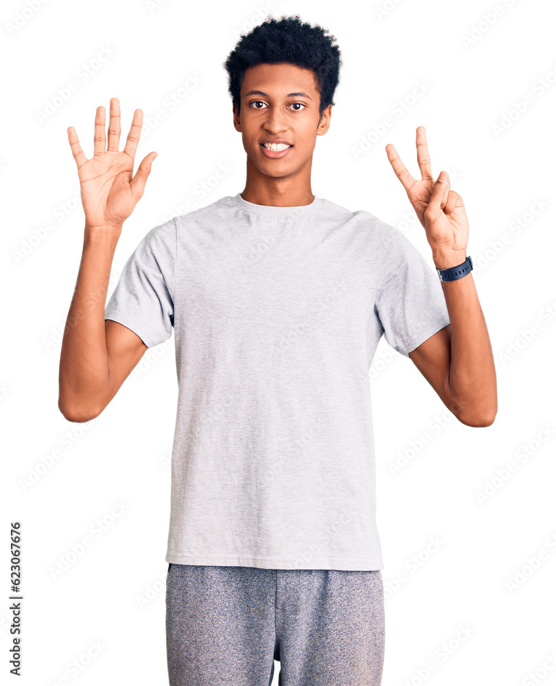 Young african american man wearing casual clothes showing and pointing up with fingers number seven while smiling confident and happy. Young african american man wearing casual clothes showing and pointing up with fingers number seven while smiling confident and happy.