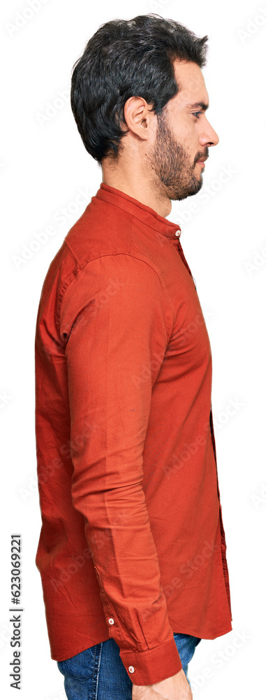 Young hispanic man wearing casual clothes looking to side, relax profile pose with natural face with confident smile. Young hispanic man wearing casual clothes looking to side, relax profile pose with natural face with confident smile.