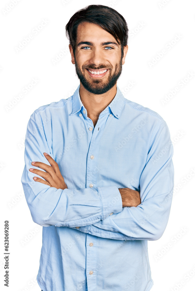 Hispanic man with blue eyes wearing business shirt happy face smiling with crossed arms looking at the camera. positive person. Hispanic man with blue eyes wearing business shirt happy face smiling with crossed arms looking at the camera. positive person.