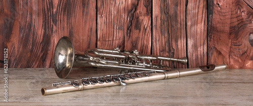 Photography horn and flute on wooden table