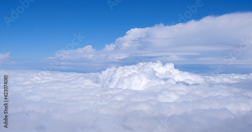 cloudscape from above. blue sky cumulus clouds. earth from above © Michalis Palis