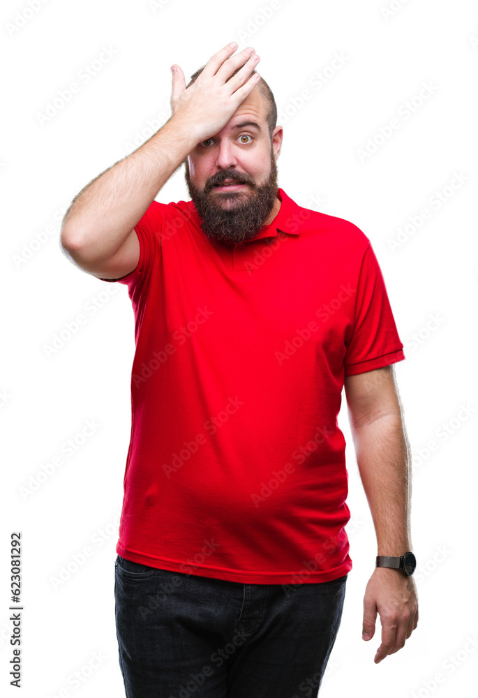 Young caucasian hipster man wearing red shirt over isolated background surprised with hand on head for mistake, remember error. Forgot, bad memory concept. Young caucasian hipster man wearing red shirt over isolated background surprised with hand on head for mistake, remember error. Forgot, bad memory concept.