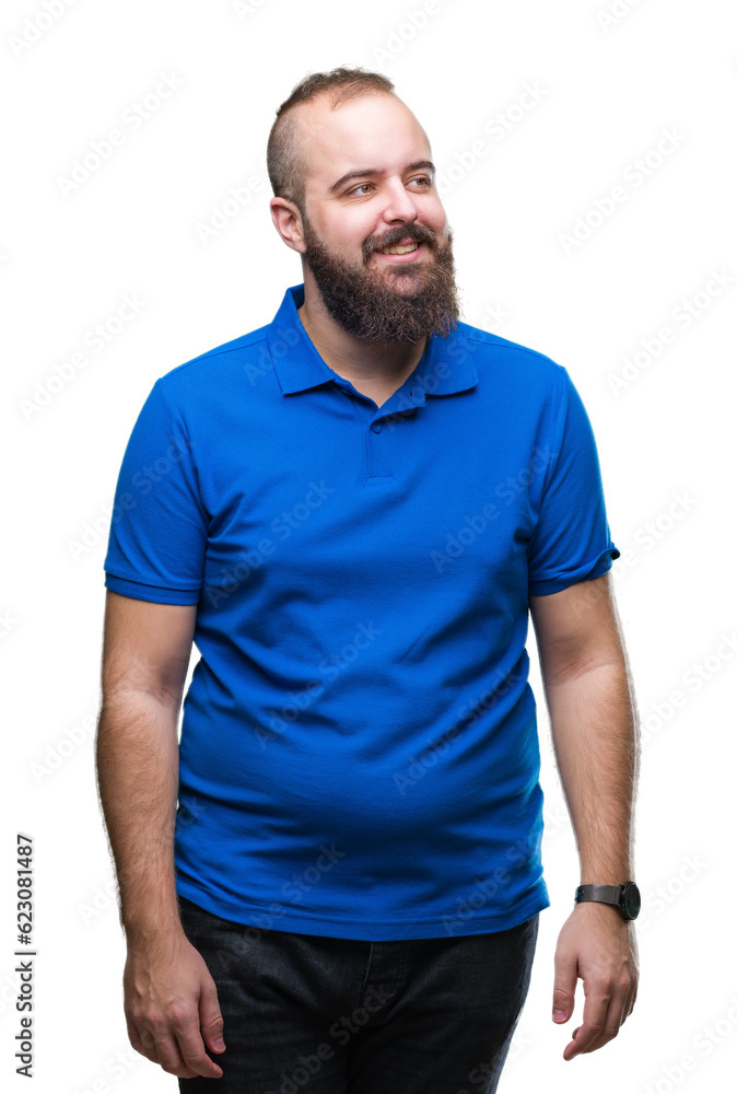 Young caucasian hipster man wearing blue shirt over isolated background smiling looking side and staring away thinking. Young caucasian hipster man wearing blue shirt over isolated background smiling looking side and staring away thinking.