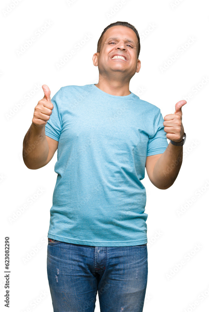 Naklejka premium Middle age arab man wearing blue t-shirt over isolated background success sign doing positive gesture with hand, thumbs up smiling and happy. Looking at the camera