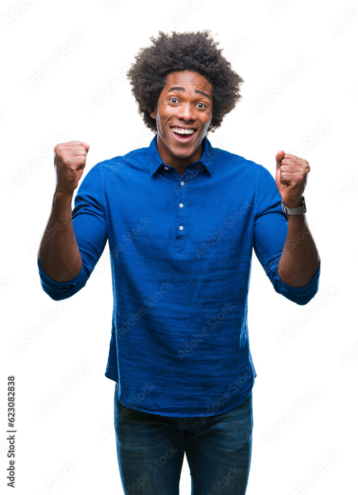 Afro american man over isolated background celebrating surprised and amazed for success with arms raised and open eyes. Winner concept. Afro american man over isolated background celebrating surprised and amazed for success with arms raised and open eyes. Winner concept.