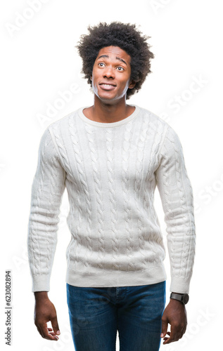 Afro american man over isolated background smiling looking side and staring away thinking.