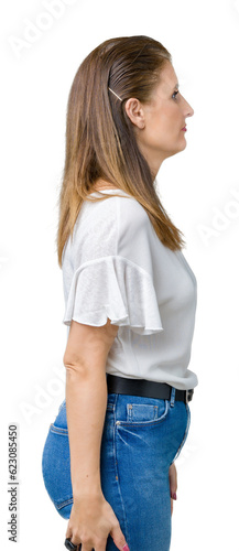 Middle age mature beautiful woman over isolated background looking to side, relax profile pose with natural face with confident smile.