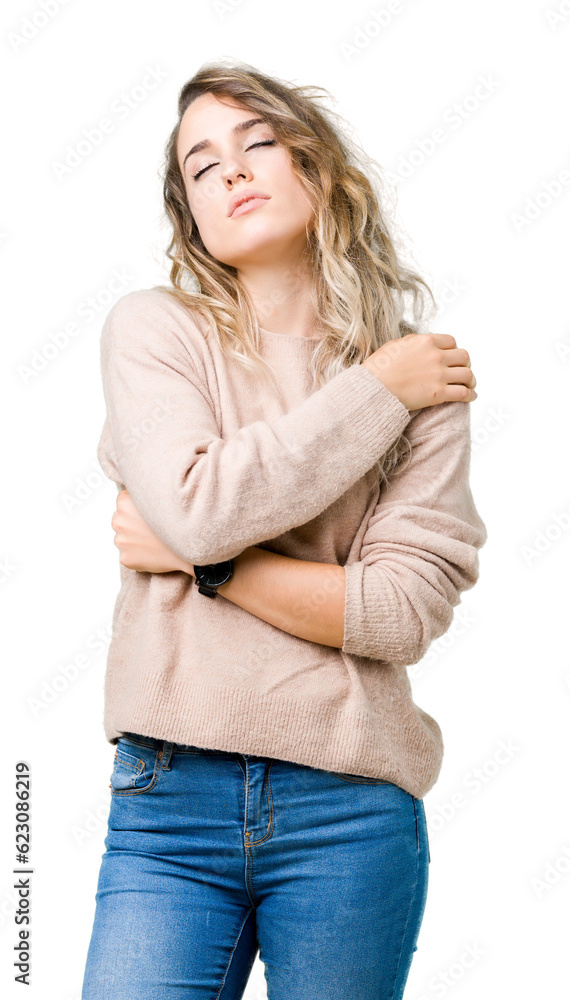 Beautiful young blonde woman wearing sweatershirt over isolated background Hugging oneself happy and positive, smiling confident. Self love and self care Beautiful young blonde woman wearing sweatershirt over isolated background Hugging oneself happy and positive, smiling confident. Self love and self care
