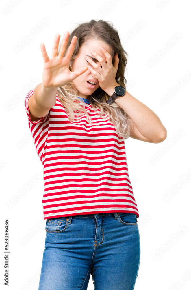 Beautiful young blonde woman over isolated background covering eyes with hands and doing stop gesture with sad and fear expression. Embarrassed and negative concept. Beautiful young blonde woman over isolated background covering eyes with hands and doing stop gesture with sad and fear expression. Embarrassed and negative concept.
