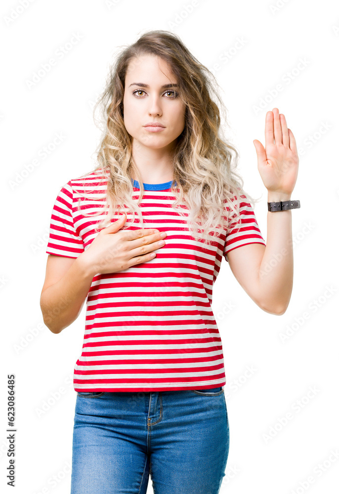 Beautiful young blonde woman over isolated background Swearing with hand on chest and open palm, making a loyalty promise oath Beautiful young blonde woman over isolated background Swearing with hand on chest and open palm, making a loyalty promise oath