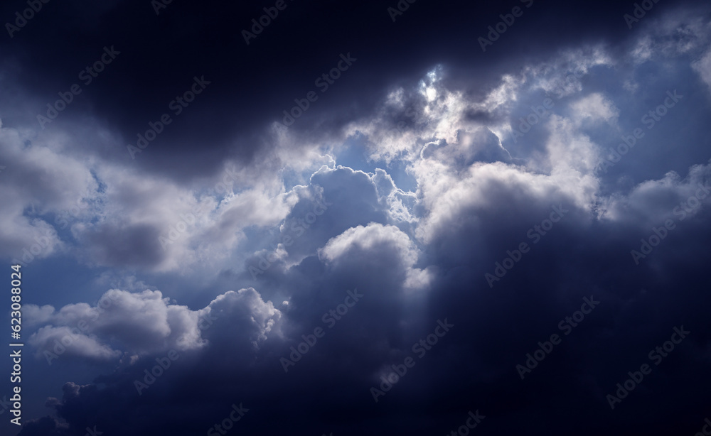 Obraz premium Blue sky with dark clouds. Nature background.