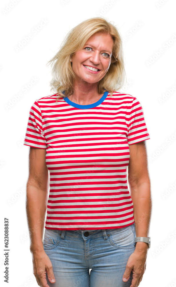 Fototapeta premium Middle age blonde woman over isolated background looking away to side with smile on face, natural expression. Laughing confident.