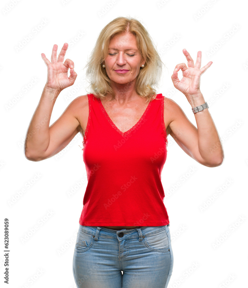 Middle age blonde woman over isolated background relax and smiling with eyes closed doing meditation gesture with fingers. Yoga concept. Middle age blonde woman over isolated background relax and smiling with eyes closed doing meditation gesture with fingers. Yoga concept.