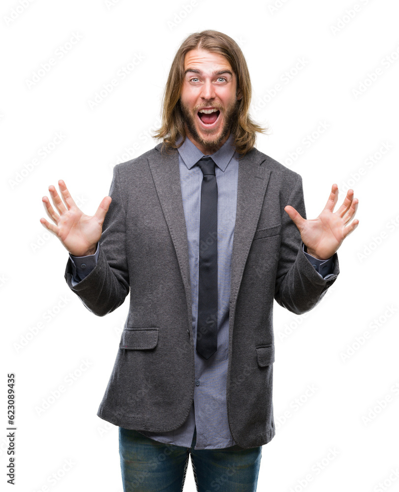 Young handsome business man with long hair over isolated background celebrating crazy and amazed for success with arms raised and open eyes screaming excited. Winner concept Young handsome business man with long hair over isolated background celebrating crazy and amazed for success with arms raised and open eyes screaming excited. Winner concept