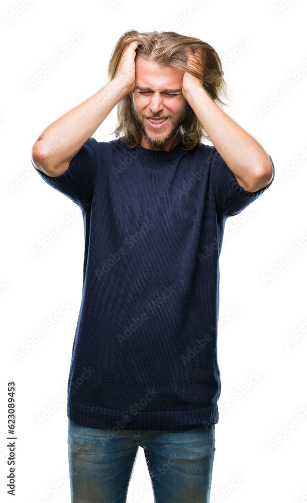 Young handsome man with long hair wearing winter sweater over isolated background suffering from headache desperate and stressed because pain and migraine. Hands on head.