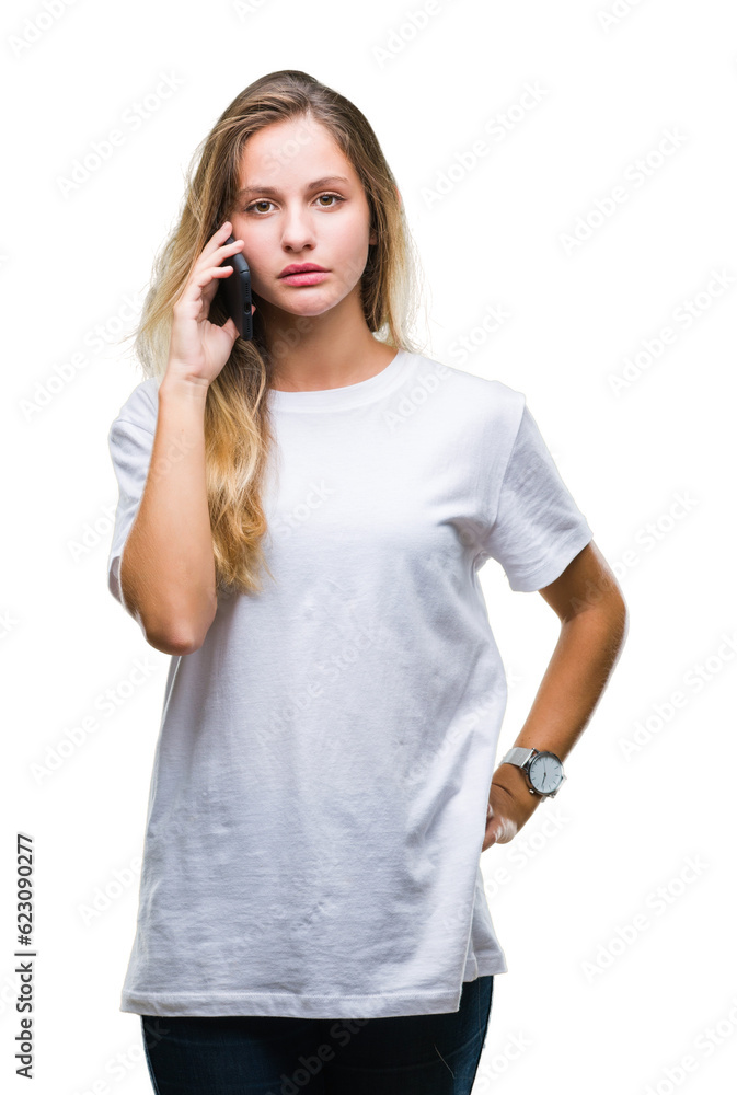Young beautiful blonde woman calling using smartphone over isolated background with a confident expression on smart face thinking serious Young beautiful blonde woman calling using smartphone over isolated background with a confident expression on smart face thinking serious