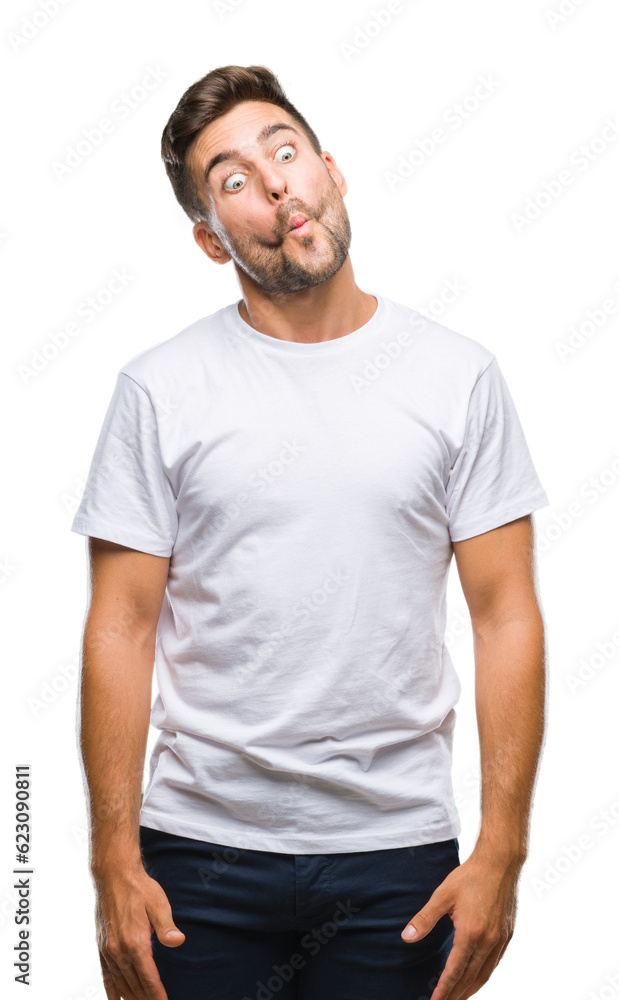 Young handsome man over isolated background making fish face with lips, crazy and comical gesture. Funny expression. Young handsome man over isolated background making fish face with lips, crazy and comical gesture. Funny expression.