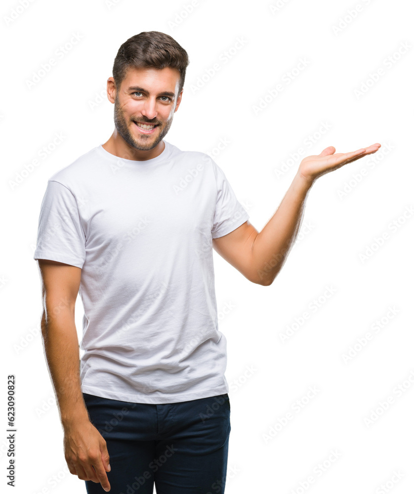 Young handsome man over isolated background smiling cheerful presenting and pointing with palm of hand looking at the camera. Young handsome man over isolated background smiling cheerful presenting and pointing with palm of hand looking at the camera.