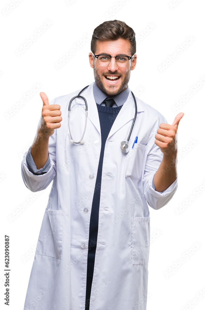 Young handsome doctor man over isolated background success sign doing positive gesture with hand, thumbs up smiling and happy. Looking at the camera with cheerful expression, winner gesture. Young handsome doctor man over isolated background success sign doing positive gesture with hand, thumbs up smiling and happy. Looking at the camera with cheerful expression, winner gesture.