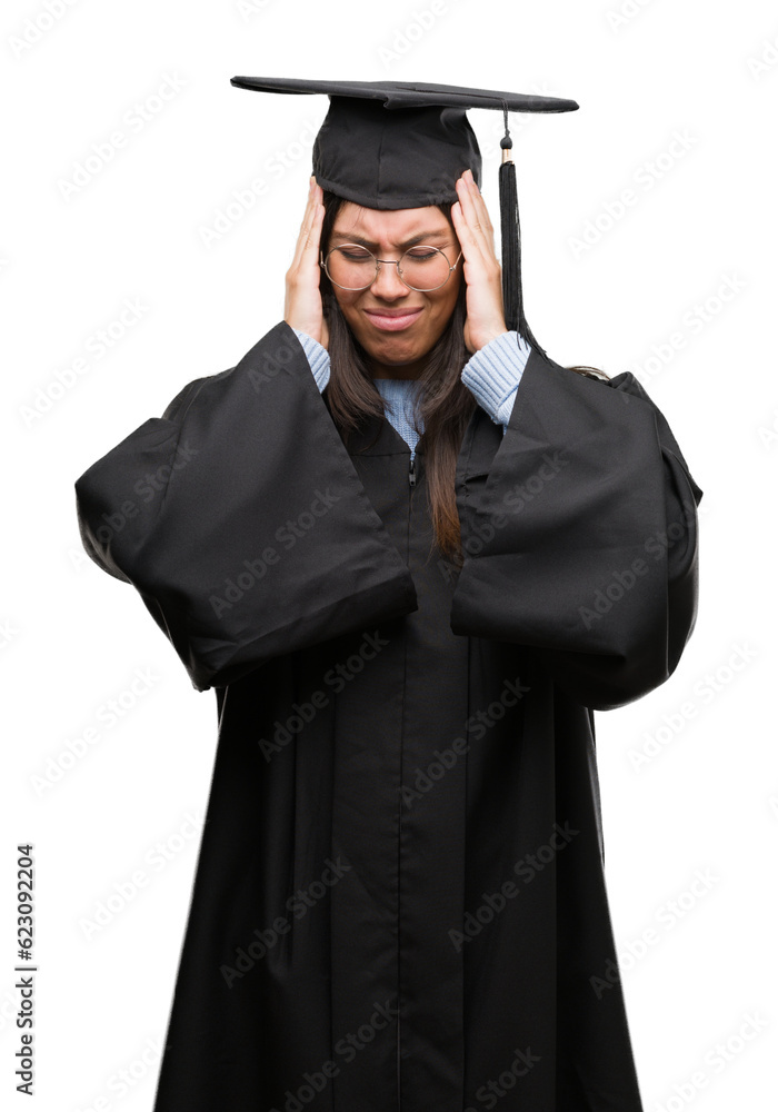 Young hispanic woman wearing graduated cap and uniform suffering from headache desperate and stressed because pain and migraine. Hands on head. Young hispanic woman wearing graduated cap and uniform suffering from headache desperate and stressed because pain and migraine. Hands on head.