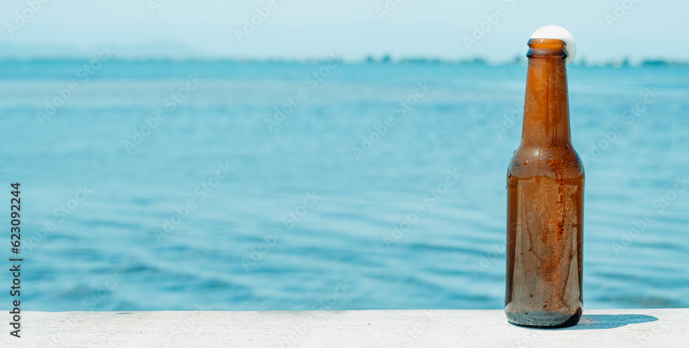 beer bottle on the pier, web banner format beer bottle on the pier, web banner format
