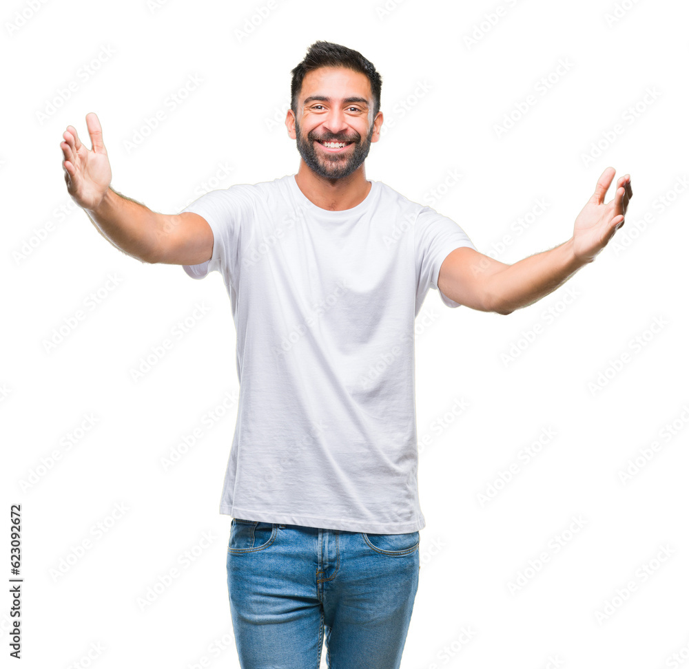 Adult hispanic man over isolated background looking at the camera smiling with open arms for hug. Cheerful expression embracing happiness. Adult hispanic man over isolated background looking at the camera smiling with open arms for hug. Cheerful expression embracing happiness.