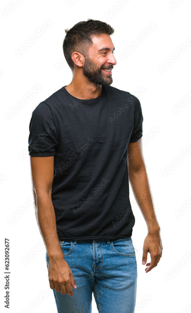 Adult hispanic man over isolated background looking away to side with smile on face, natural expression. Laughing confident. Adult hispanic man over isolated background looking away to side with smile on face, natural expression. Laughing confident.