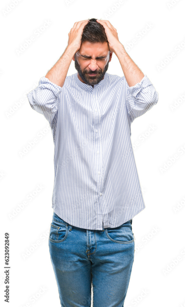 Adult hispanic man over isolated background suffering from headache desperate and stressed because pain and migraine. Hands on head. Adult hispanic man over isolated background suffering from headache desperate and stressed because pain and migraine. Hands on head.