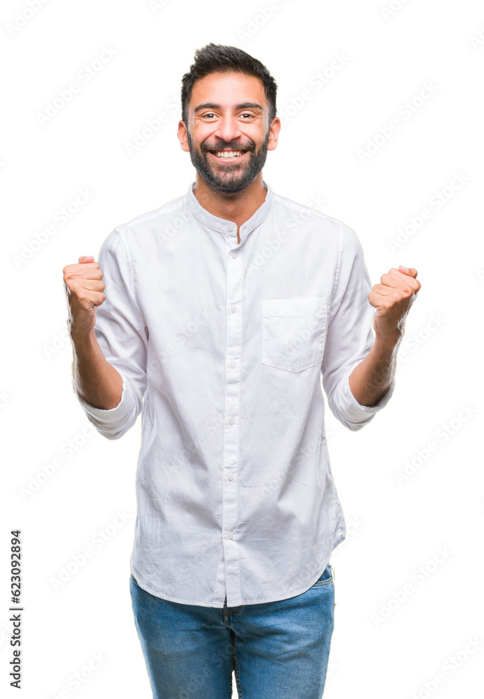 Adult hispanic man over isolated background celebrating surprised and amazed for success with arms raised and open eyes. Winner concept. Adult hispanic man over isolated background celebrating surprised and amazed for success with arms raised and open eyes. Winner concept.