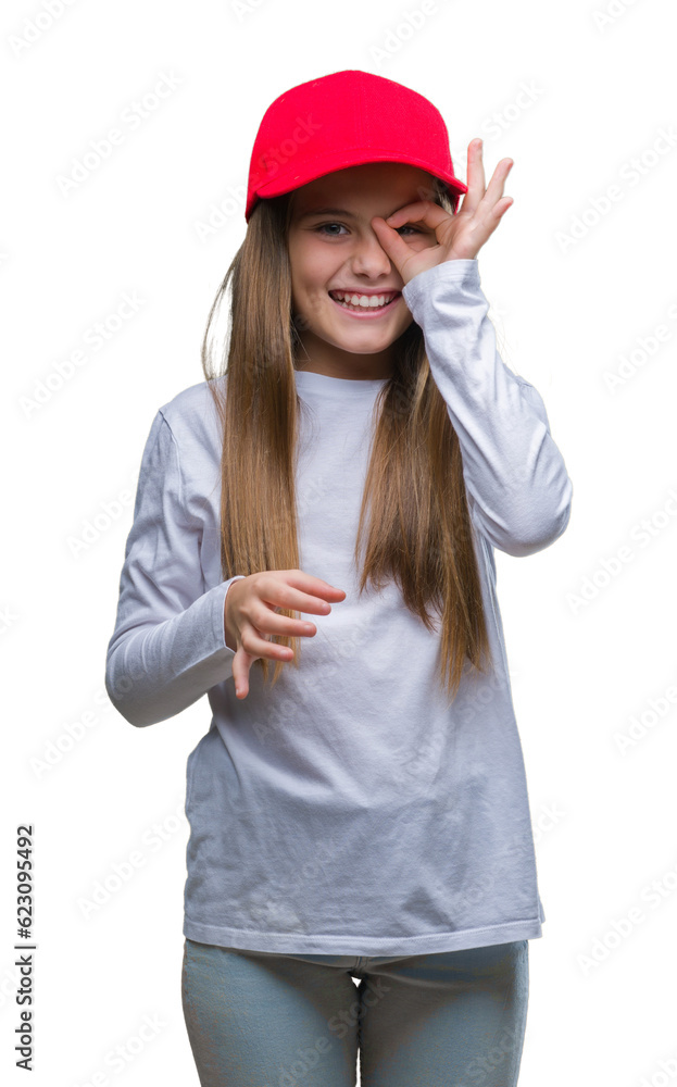 Young beautiful girl wearing red cap isolated background doing ok gesture with hand smiling, eye looking through fingers with happy face. Young beautiful girl wearing red cap isolated background doing ok gesture with hand smiling, eye looking through fingers with happy face.