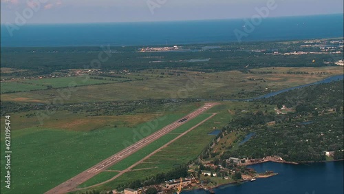 aerial wide shot of small airport runway seen from above, Spilve airport photo