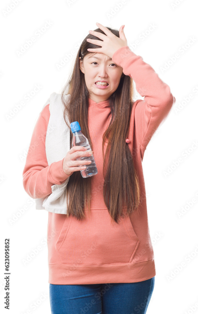 Young Chinese woman over isolated background wearing sport sweathshirt stressed with hand on head, shocked with shame and surprise face, angry and frustrated. Fear and upset for mistake. Young Chinese woman over isolated background wearing sport sweathshirt stressed with hand on head, shocked with shame and surprise face, angry and frustrated. Fear and upset for mistake.