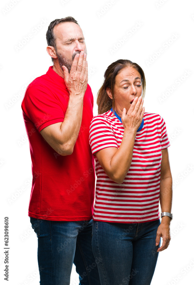 Middle age hispanic couple in love over isolated background bored yawning tired covering mouth with hand. Restless and sleepiness. Middle age hispanic couple in love over isolated background bored yawning tired covering mouth with hand. Restless and sleepiness.
