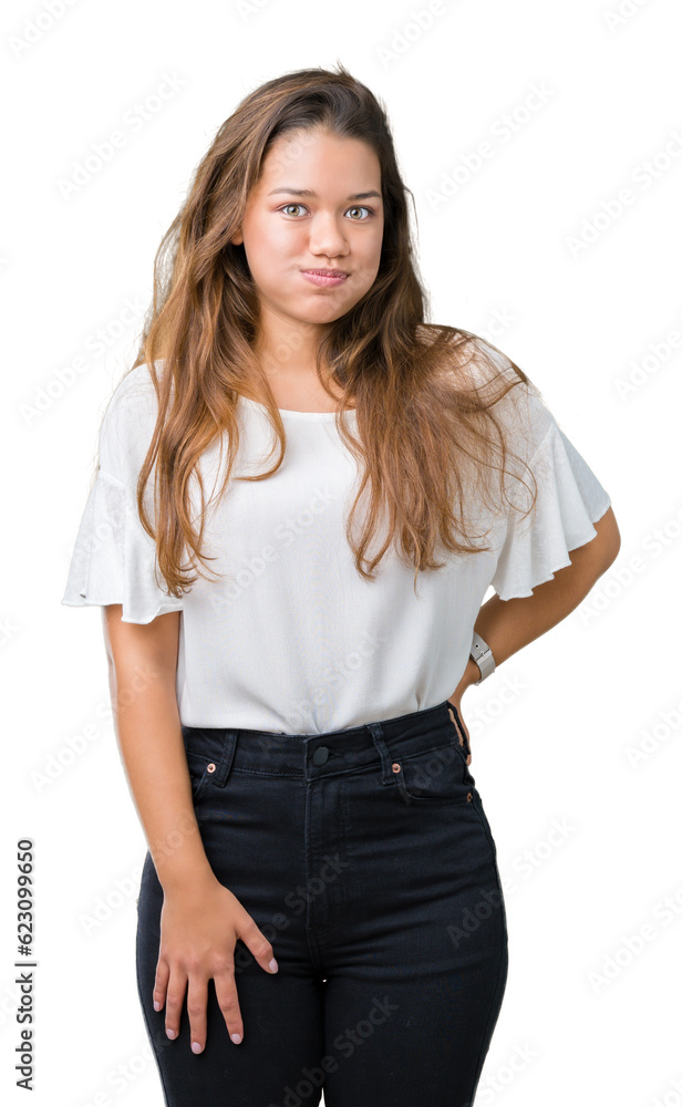 Obraz premium Young beautiful brunette business woman over isolated background puffing cheeks with funny face. Mouth inflated with air, crazy expression.