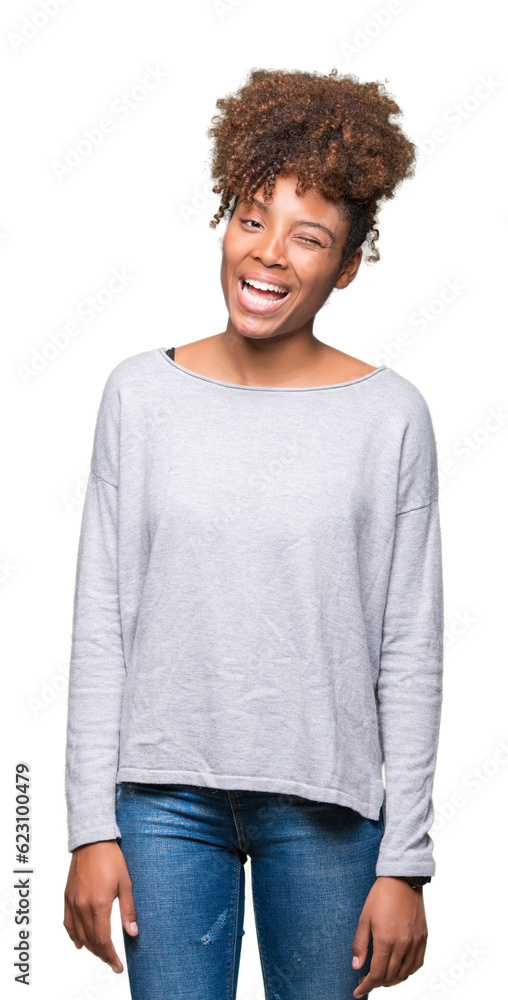 Beautiful young african american woman over isolated background winking looking at the camera with sexy expression, cheerful and happy face. Beautiful young african american woman over isolated background winking looking at the camera with sexy expression, cheerful and happy face.