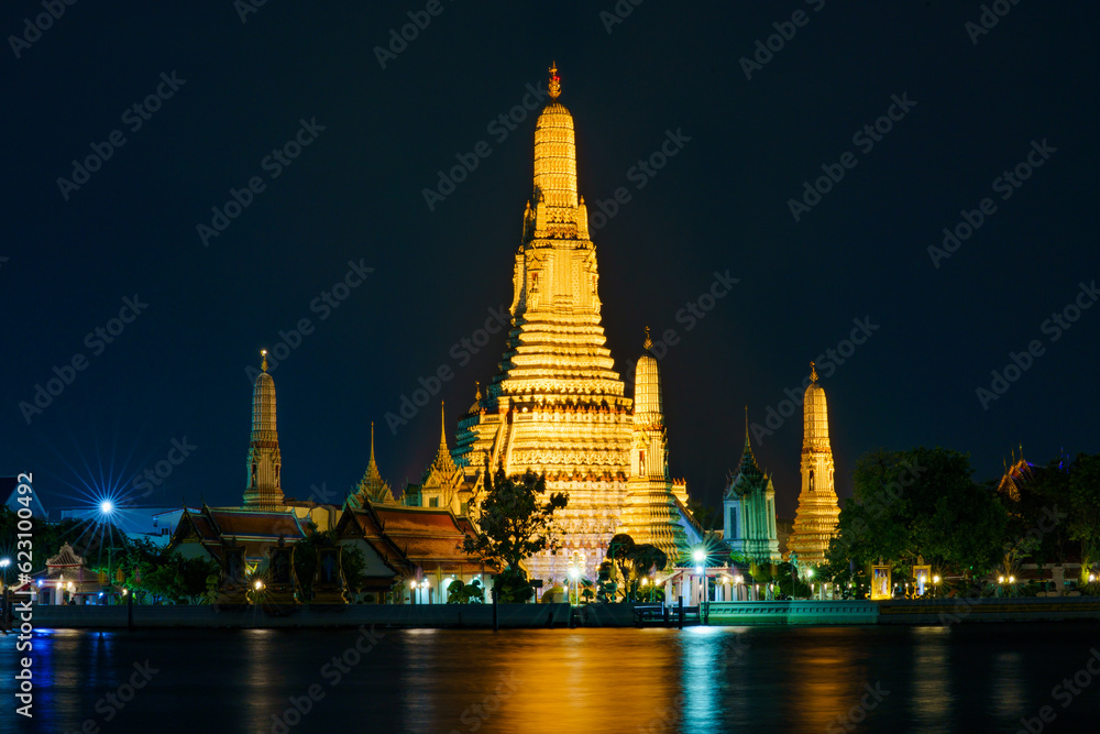 Photograph of Wat Arun Chedi at night.
