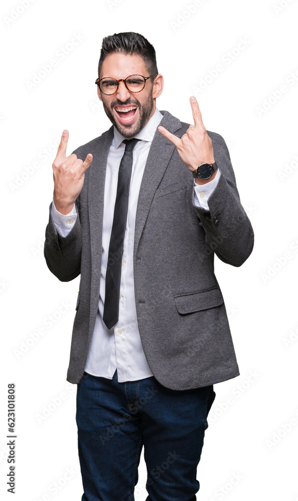 Young handsome business man over isolated background shouting with crazy expression doing rock symbol with hands up. Music star. Heavy concept. Young handsome business man over isolated background shouting with crazy expression doing rock symbol with hands up. Music star. Heavy concept.