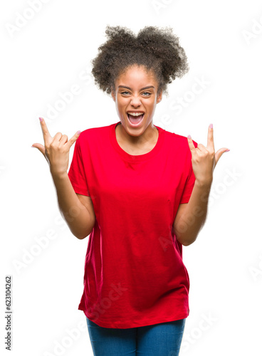 Young afro american woman over isolated background shouting with crazy expression doing rock symbol with hands up. Music star. Heavy concept.